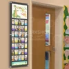 Wall-mounted classroom photo board with student headshots and a dragon-themed class title