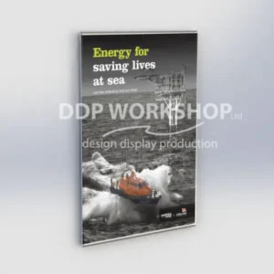 Clear acrylic frameless poster frame wall-mounted with an ocean safety awareness poster inside, featuring a lifeboat at sea.