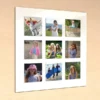 Wall-mounted acrylic photo frame with nine square photo slots and a glossy white background