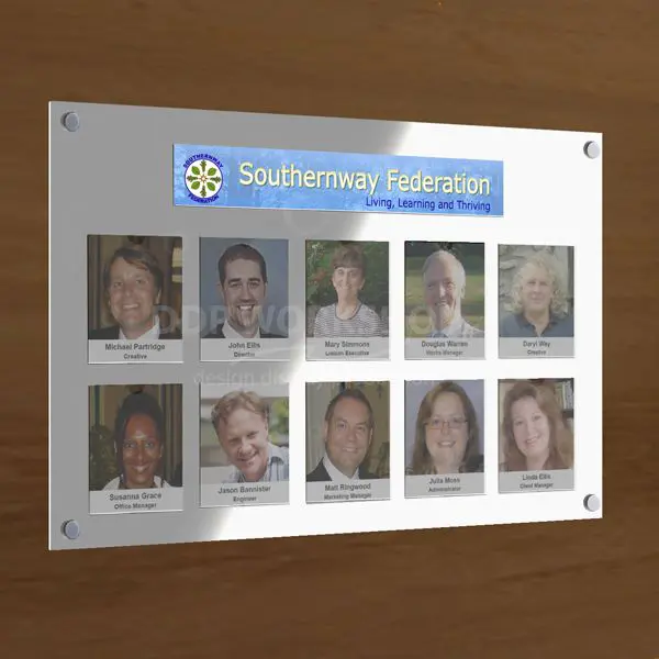 Wall-mounted acrylic photoboard with 3x4 photo layout, featuring clear name labels and satin chrome mounts.