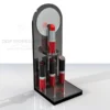 Black acrylic tower lipstick display stand with mirrored backing and red-branded base, showcasing five red lipsticks.