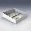 White acrylic tray with clear Perspex dividers used for organising small colourful items in retail.