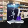 Elegant perfume display with ice dancer silhouette and branded header