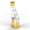 Tall freestanding cardboard book display stand with angled shelves and full-colour printed graphics promoting a book titled “Freedom.”