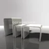 Set of three white acrylic bridge risers with polished edges, arranged by size on a glossy surface.