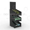 Three-tier black acrylic confectionery display stand with vitamin and energy gum packs
