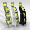 Floor-standing 3-shelf magazine displays in clear, white, and black acrylic, each showcasing a floral publication.