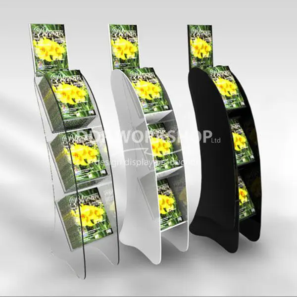 Floor-standing 3-shelf magazine displays in clear, white, and black acrylic, each showcasing a floral publication.