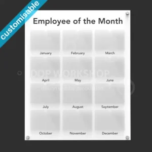 White acrylic Employee of the Month board with twelve clear photo pockets, labelled by month, mounted on a dark wall.