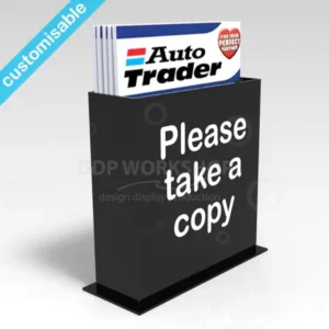 Black tabletop acrylic brochure holder with "Please take a copy" text and Auto Trader magazines displayed.