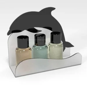 Frosted acrylic bathroom toiletries tray with a black dolphin-shaped back panel, holding three miniature bottles.