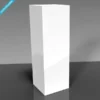 Minimalist white acrylic display plinth pedestal on a dark reflective surface.