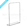 Clear acrylic checkout safety screen with base return for stability, designed for customer-facing counters.