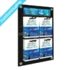 Wall-mounted gift card display with 4 eurohook positions and a branded aquarium-themed header insert on a polished black Perspex backboard.