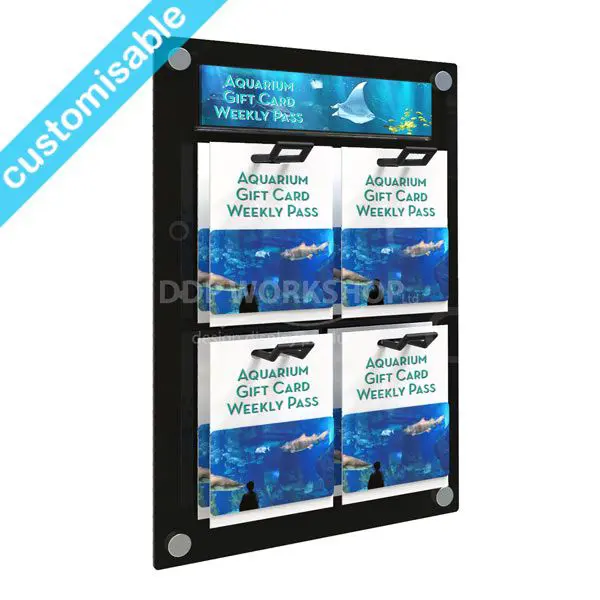 Wall-mounted gift card display with 4 eurohook positions and a branded aquarium-themed header insert on a polished black Perspex backboard.
