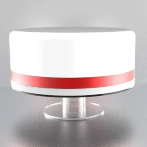 Sleek round acrylic pedestal cake stand with a polished clear base and wide top, displaying a tiered cake with red ribbon detail.