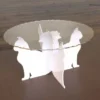 acrylic cupcake stand with a scalloped clear top plate supported by four white acrylic cat silhouettes.
