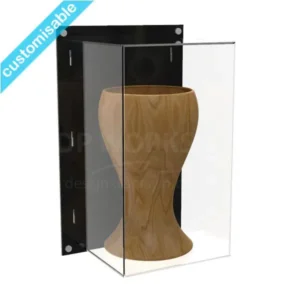 Small clear Perspex wall-mounted display case with a black back panel, showcasing a gold-trimmed brown object. Satin silver fixings visible at the corners.
