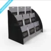Three-tier black acrylic countertop gift card display stand filled with hanging product cards, labelled “GEMS gift card”.