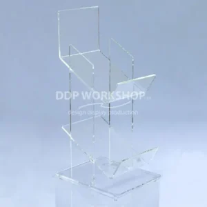 Clear acrylic 2-tier tabloid pick-up display stand designed for showcasing magazines or promotional materials.