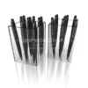 Clear acrylic tub display holding multiple black pens in a vertical arrangement.