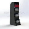 Freestanding black display stand with three angled shelves holding 7-inch vinyl records and a full-colour branded header