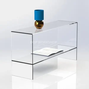 Clear acrylic display table with integrated shelf, shown with an open book and decorative vase on a glossy white background.