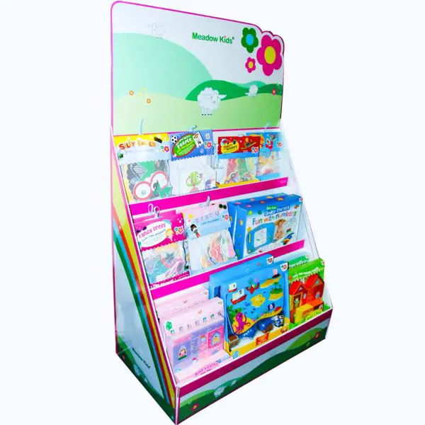 Freestanding cardboard display unit with three tiered shelves holding colourful children’s books and activity packs, featuring a Meadow Kids-branded header.