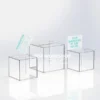 Three transparent acrylic ballot boxes of varying sizes with top posting slots, shown with suggestion cards.
