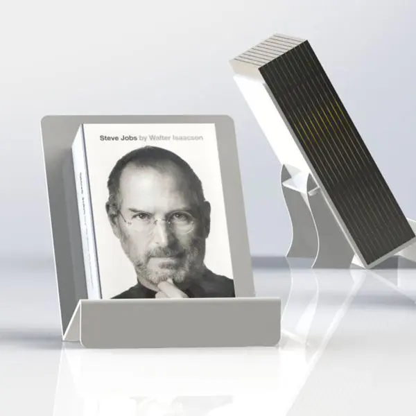 Acrylic book display stand holding Steve Jobs biography in upright position