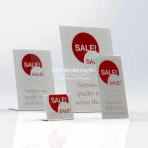 Set of clear acrylic lean-back tabletop POS holders displaying red "SALE!" signs in various sizes.