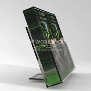 Angled clear acrylic counter display stand holding two upright stacks of magazines with full cover visibility.