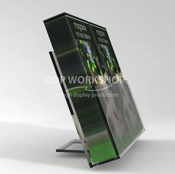 Angled clear acrylic counter display stand holding two upright stacks of magazines with full cover visibility.