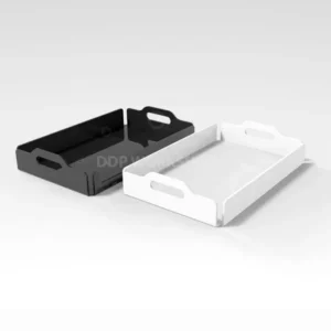 Black and white acrylic trays with handles and raised edges, used for serving or organising